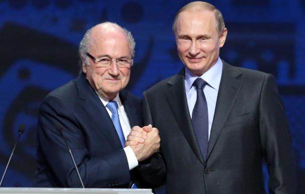 Outgoing FIFA president Sepp Blatter shakes hands