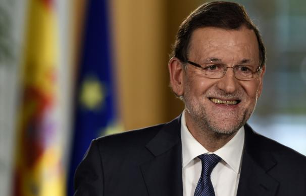 Spanish Prime Minister Mariano Rajoy smiles during
