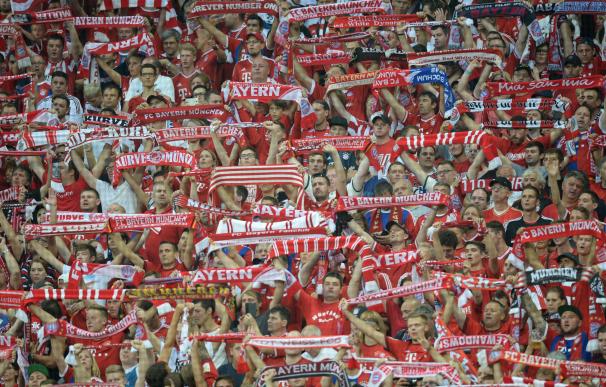 Fans of Bayern Munich cheer during the German firs