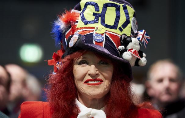 A pro-Brexit campaigner smiles at a public meeting