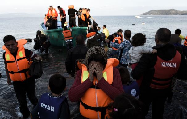Refugees and migrants disembark on the Greek Lesbo