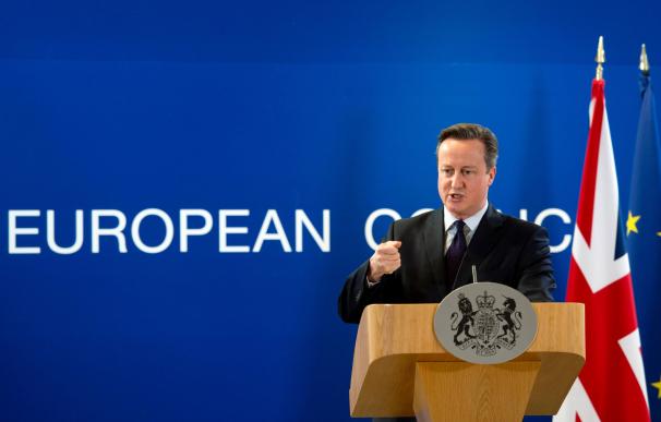 British Prime Minister David Cameron holds a press
