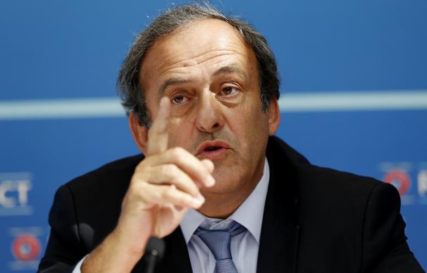 UEFA chief Michel Platini gestures as he speaks du