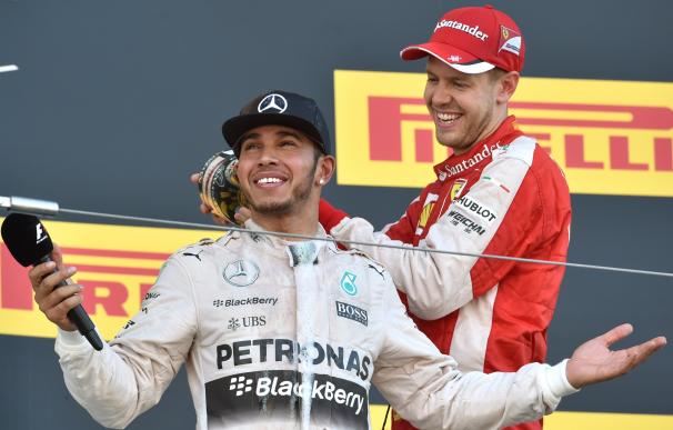 Mercedes driver Lewis Hamilton of Britain (L) cele