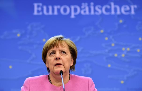 German Chancellor Angela Merkel addresses a press