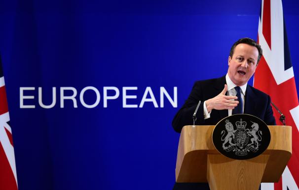 TOPSHOT - British Prime Minister David Cameron add