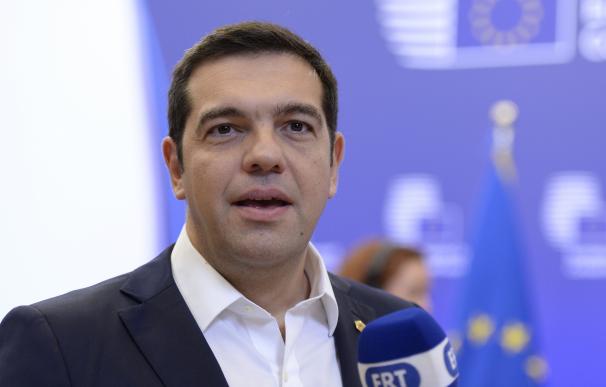 Greek Prime Minister Alexis Tsipras leaves at the