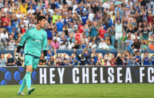 Chelsea goalkeeper Thibaut Courtois reacts after s