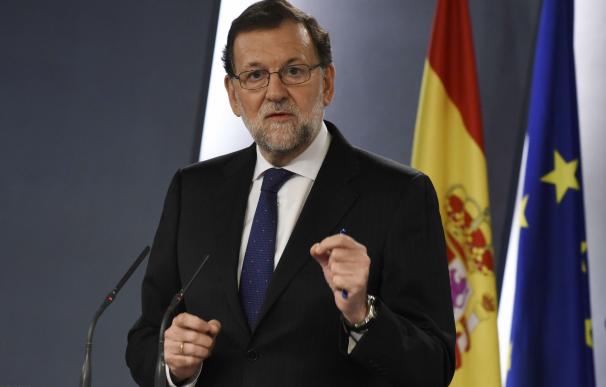 Spanish Prime Minister Mariano Rajoy gestures duri