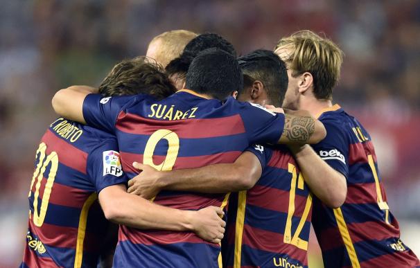 Barcelona players celebrate their goal during the