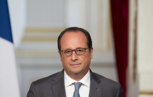 French President Francois Hollande speaks during a