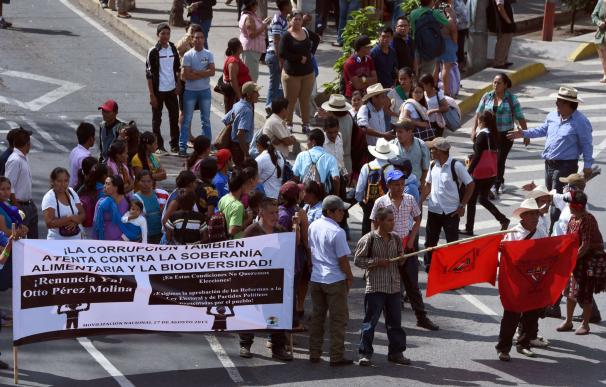 Indigenous people block a street in Guatemala City