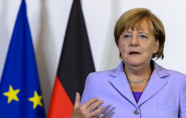 German Chancellor Angela Merkel gestures during a