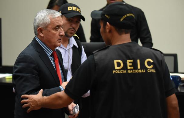 Guatemalan ex-President Otto Perez (L) is taken aw