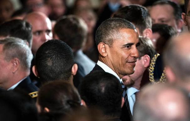 US President Barack Obama leaves after presenting