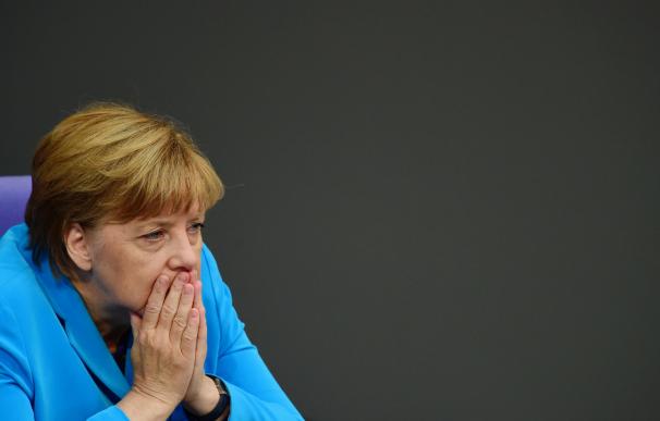 German chancellor Angela Merkel reacts during a si