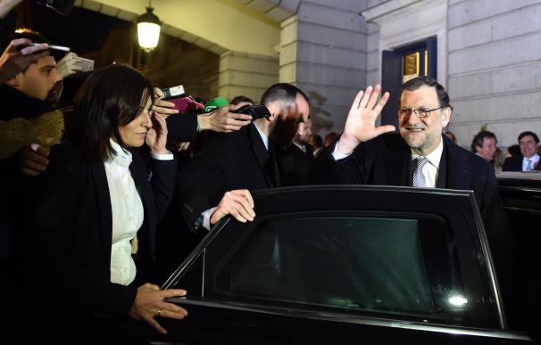 Spain's acting Prime Minister Mariano Rajoy waves
