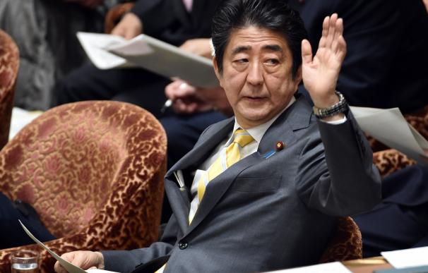Japanese Prime Minister Shinzo Abe takes part a bu