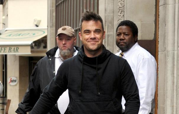 Robbie Williams confiesa que Mila Kunis es su amor platónico