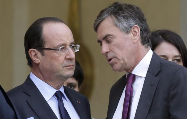 El presidente francés, François Hollande, y el ministro de Presupuestos, Jerome Cahuzac.