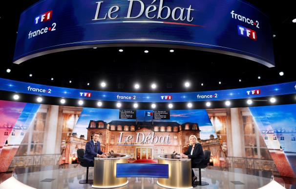 Le Pen y Macron debate